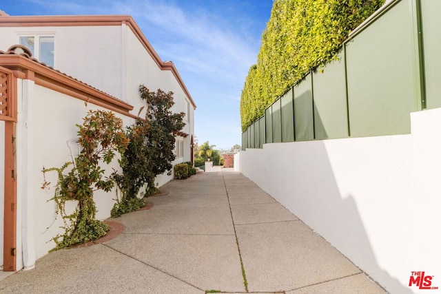 view of side of property featuring a patio area