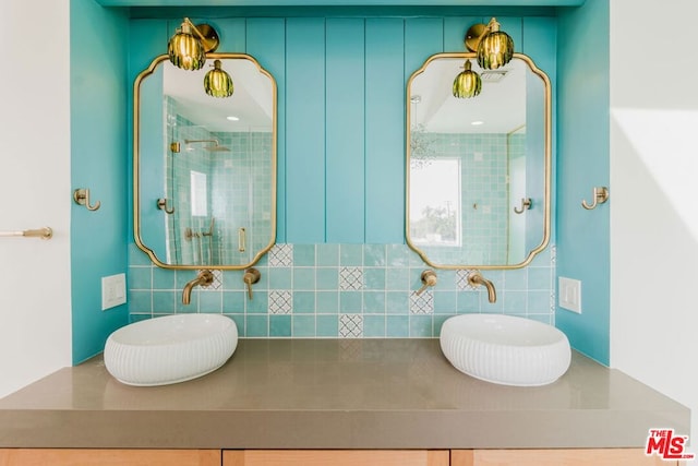 bathroom with sink and a shower with shower door