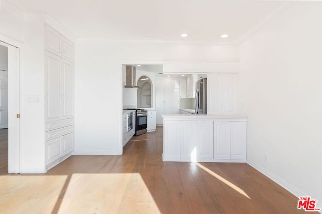 interior space with light hardwood / wood-style flooring and ornamental molding