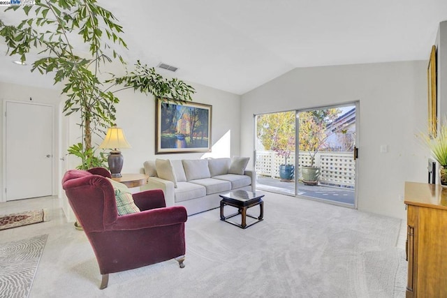 living room featuring light carpet and lofted ceiling