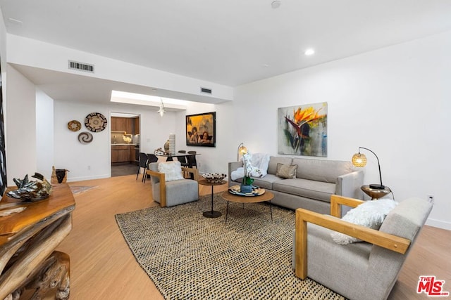 living room with light hardwood / wood-style floors