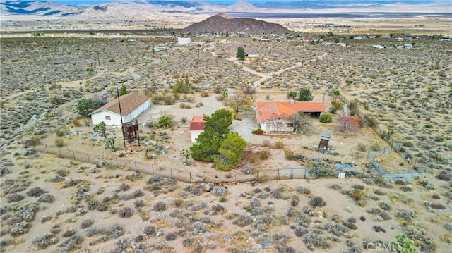 birds eye view of property with a mountain view