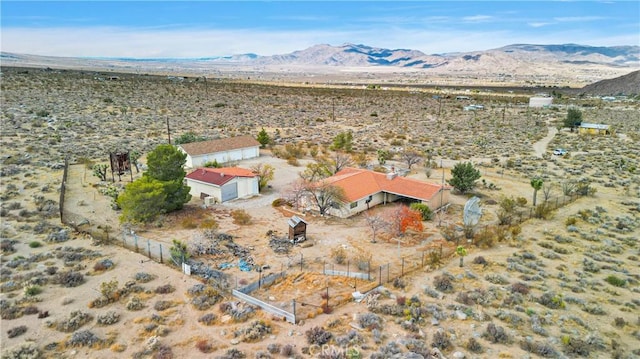 birds eye view of property featuring a mountain view