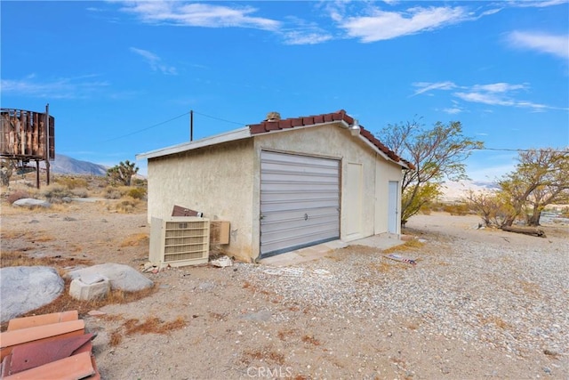 garage featuring a mountain view