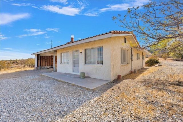 view of front of property with a patio