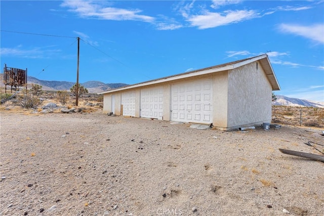 garage featuring a mountain view