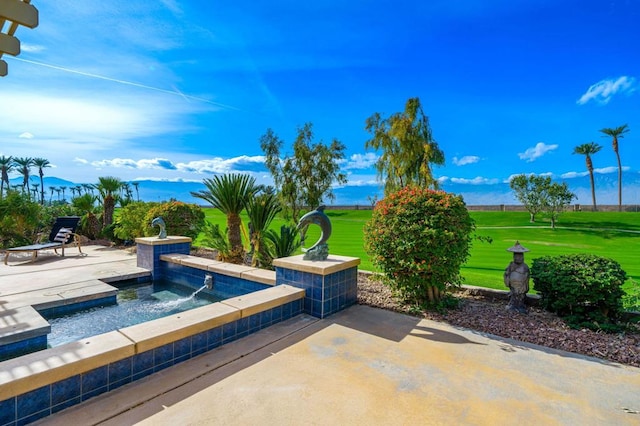 view of pool featuring a patio area, a lawn, and pool water feature