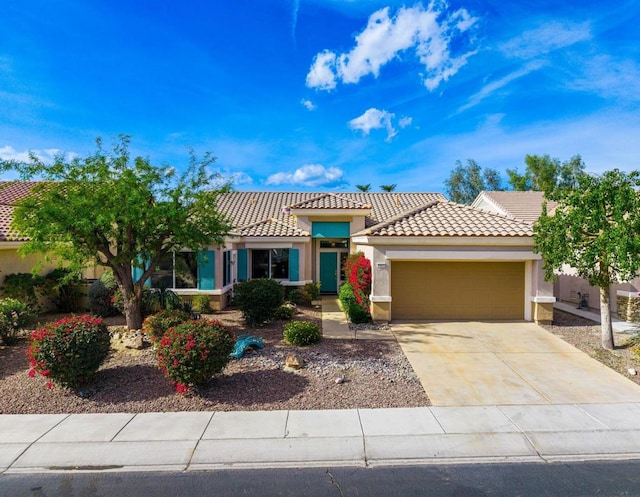 mediterranean / spanish-style home with a garage