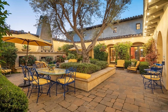 patio terrace at dusk with french doors