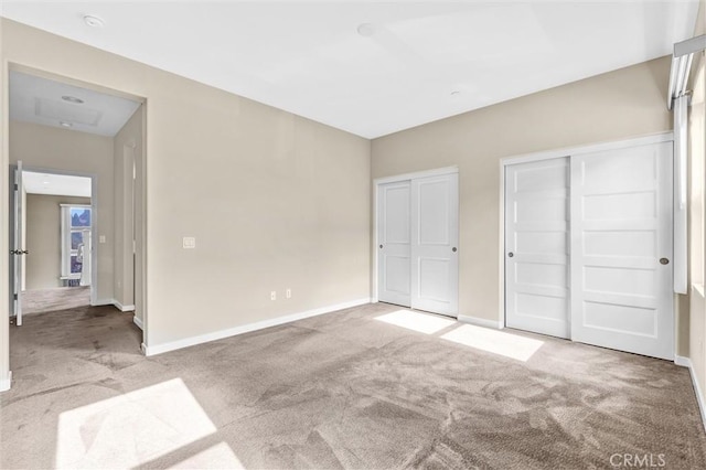 unfurnished bedroom featuring light colored carpet