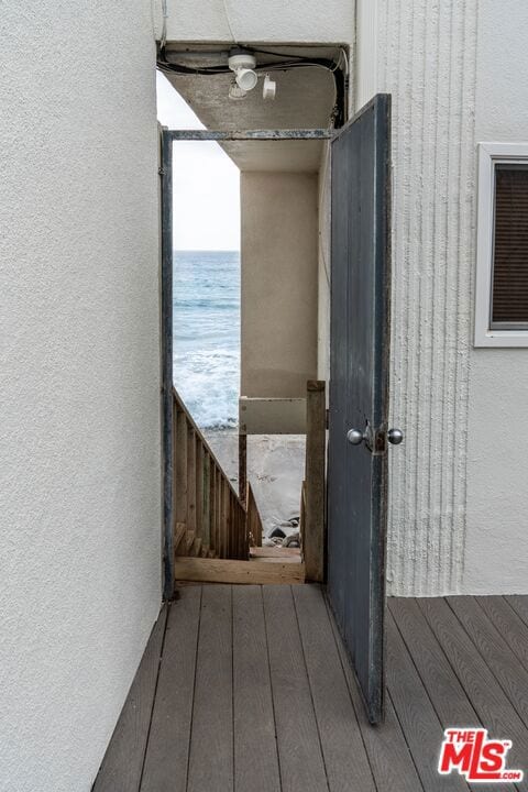 entrance to property with a water view