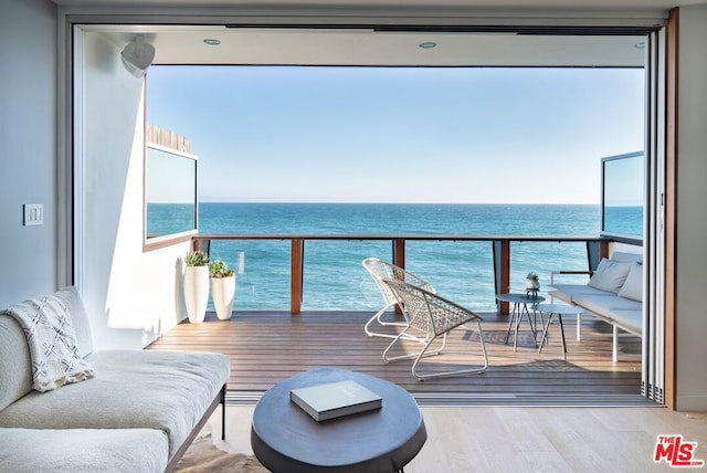 balcony featuring a water view