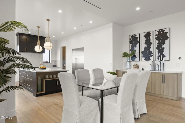 dining room with light hardwood / wood-style flooring