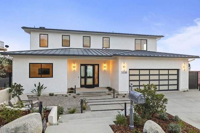 modern farmhouse featuring a garage