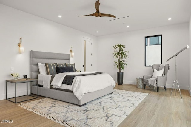 bedroom featuring ceiling fan and light hardwood / wood-style floors