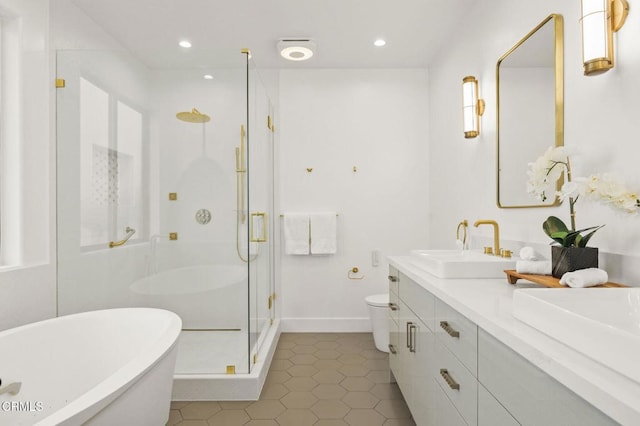 full bathroom featuring plus walk in shower, vanity, tile patterned floors, and toilet