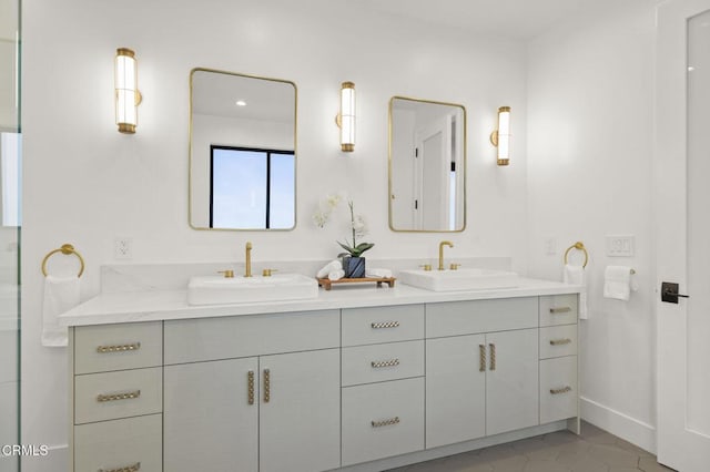 bathroom featuring tile patterned flooring and vanity