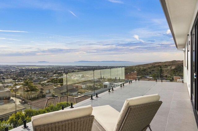 balcony featuring a mountain view