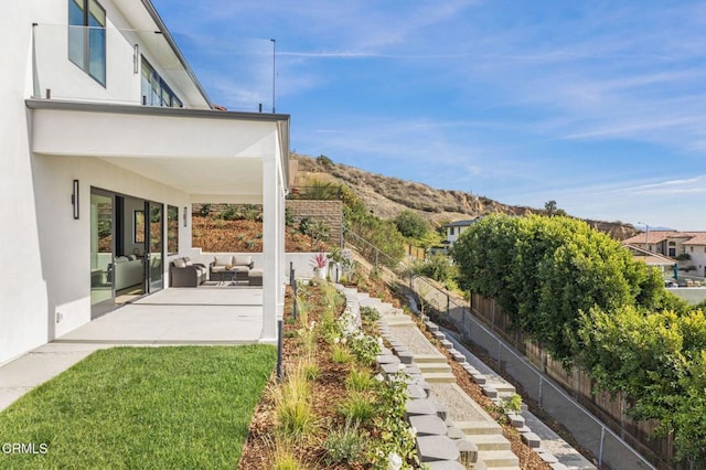 view of yard with an outdoor hangout area and a patio