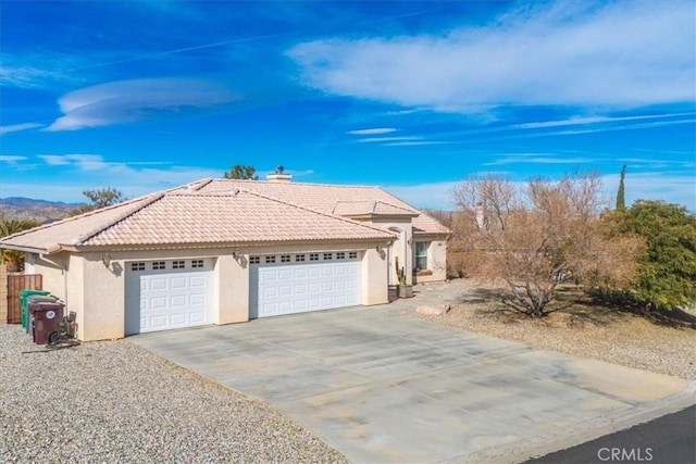 ranch-style house featuring a garage