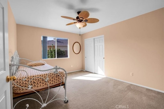 8550 Condalia Ave, Yucca Valley, CA 92284 - bedroom with carpet flooring, a closet, and ceiling fan