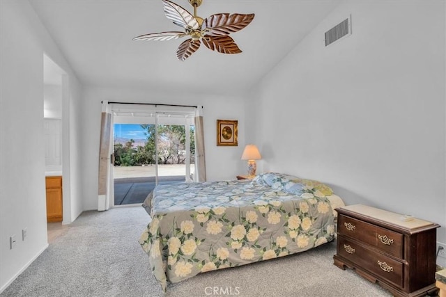 8550 Condalia Ave, Yucca Valley, CA 92284 - bedroom with access to exterior, carpet floors, vaulted ceiling, and ceiling fan
