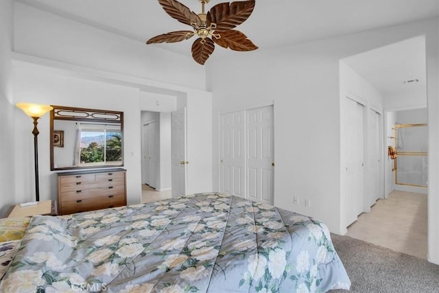 8550 Condalia Ave, Yucca Valley, CA 92284 - bedroom featuring multiple closets, carpet floors, and a ceiling fan
