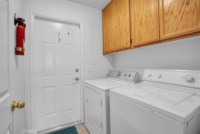 8550 Condalia Ave, Yucca Valley, CA 92284 - laundry area with cabinet space and washing machine and clothes dryer