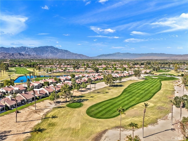 view of home's community with view of golf course, a residential view, and a water and mountain view