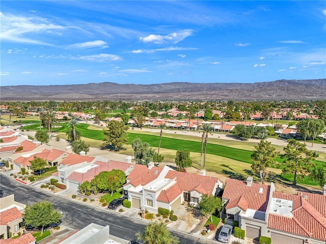 bird's eye view with view of golf course, a residential view, and a mountain view