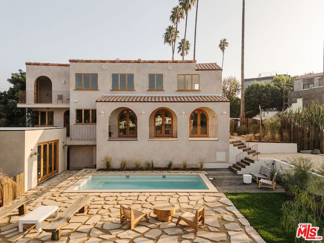 rear view of property with a patio area