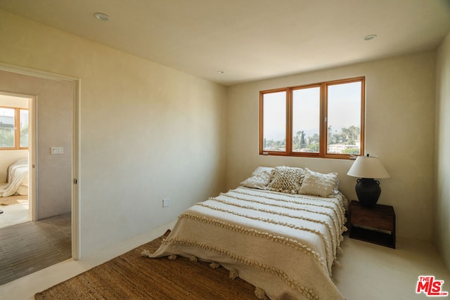 bedroom with light hardwood / wood-style floors