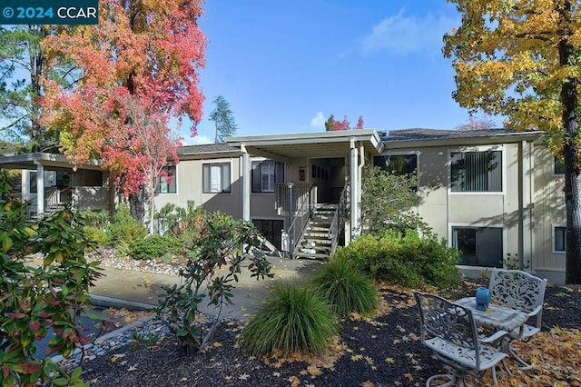 view of front of home featuring a carport