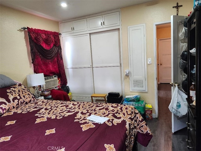 bedroom featuring dark hardwood / wood-style flooring