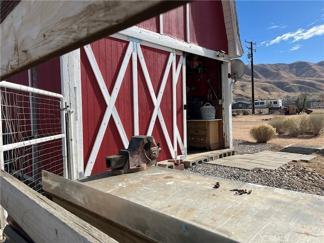 view of outbuilding featuring a mountain view