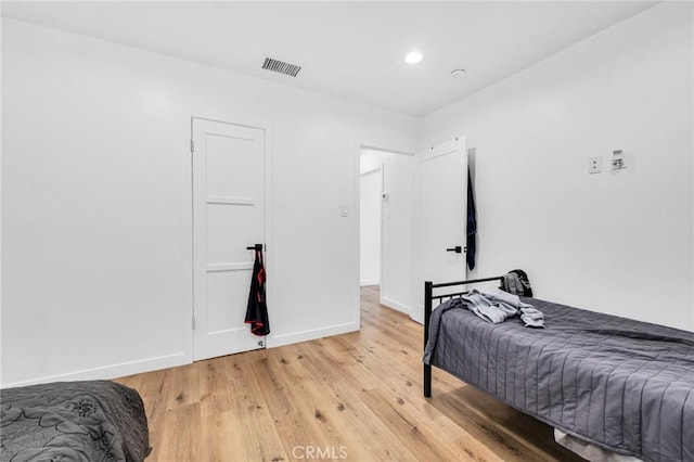 bedroom with light hardwood / wood-style floors