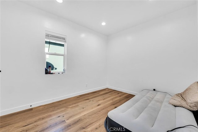 living area with hardwood / wood-style flooring