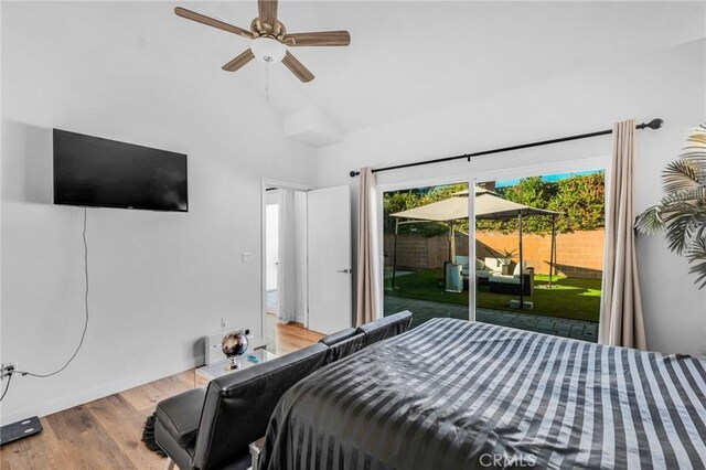 bedroom featuring access to outside, high vaulted ceiling, ceiling fan, and light wood-type flooring