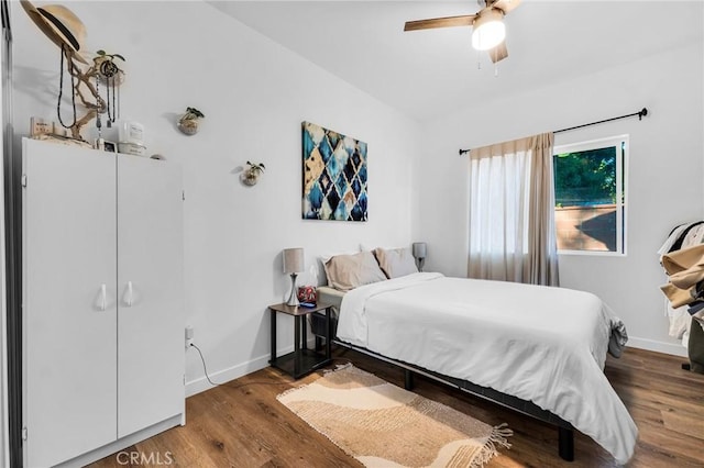 bedroom with hardwood / wood-style flooring and ceiling fan