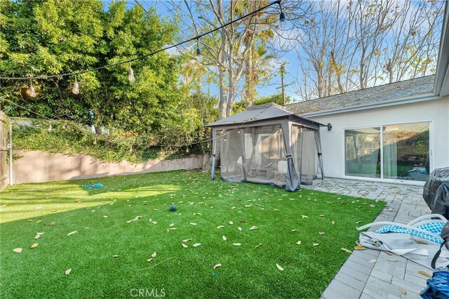 view of yard featuring a sunroom