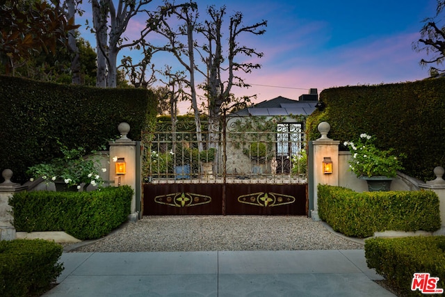 view of gate at dusk