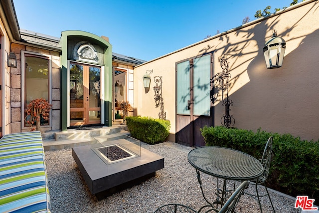 view of patio featuring a fire pit