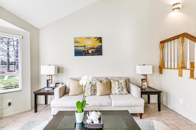 living room featuring light tile patterned floors and vaulted ceiling