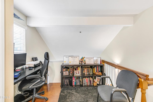 office space featuring lofted ceiling with beams and hardwood / wood-style flooring