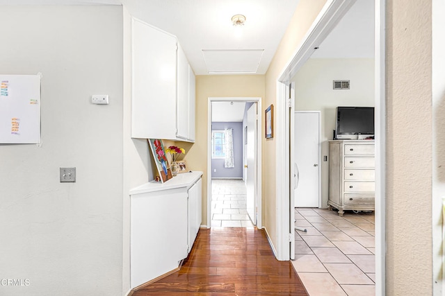 hall with light hardwood / wood-style flooring