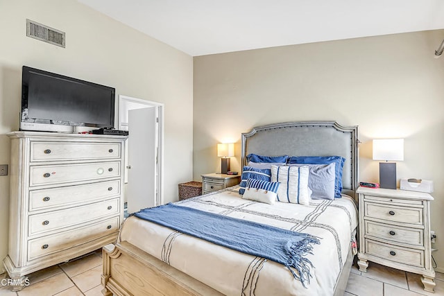 bedroom with light tile patterned flooring