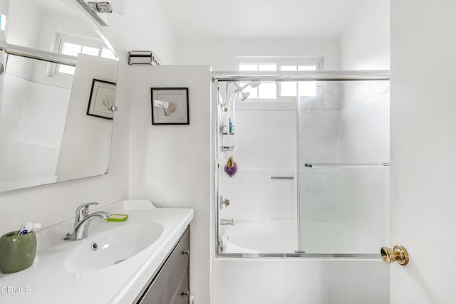 bathroom with vanity and enclosed tub / shower combo