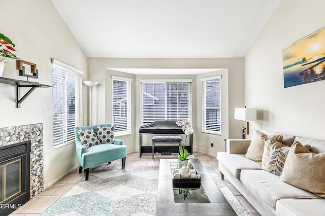 tiled living room with a stone fireplace and lofted ceiling