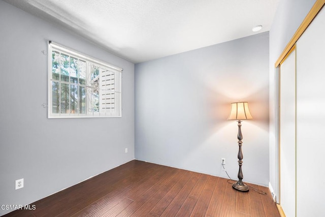 empty room featuring hardwood / wood-style floors