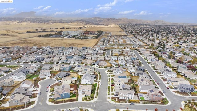 birds eye view of property with a mountain view